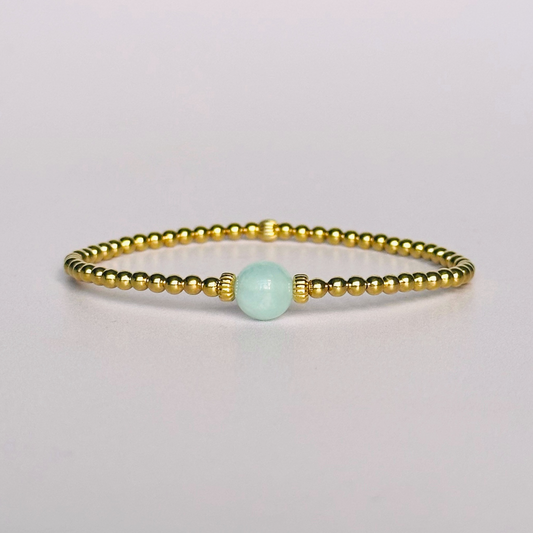 Gold vermeil aquamarine bracelet features an ethically mined 8mm aquamarine bead, flanked by corrugated rondelle beads on a band of 3mm gold vermeil beads. A bracelet to promote courage and self expression.