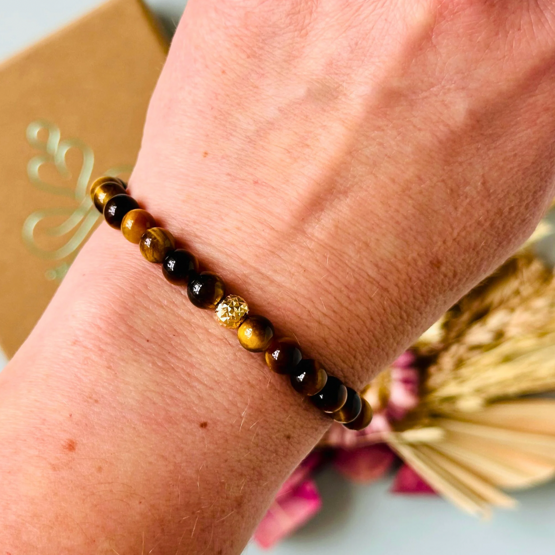 Tigers Eye bracelet featuring 6mm smooth tiger eye beads. With your choice of gold vermeil or sterling silver faceted accent beats.