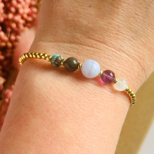 This gold vermeil Pisces bracelet is made with a selection of five healing crystals all believed to resonate with the Pisces zodiac sign. The central bead is 8mm, the other four are 6mm. On an elasticated band of 3mm gold vermeil beads with corrugated accent beads. Featuring turquoise, bloodstone, blue lace agate, amethyst and selenite.