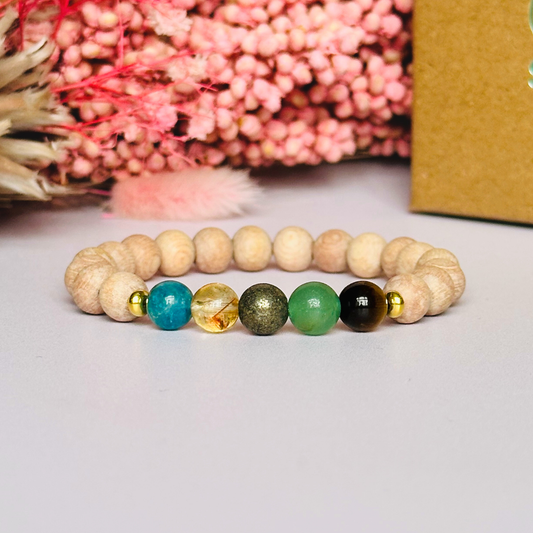 Essential oil diffuser bracelet with five crystals all believed to help with manifestation. Featuring raw rosewood beads to diffuse aromatherapy oils. With apatite, citrine, pyrite, green aventurine and tigers eye. All beads are 8 mm.