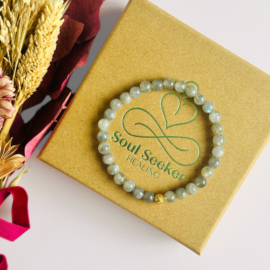 This labradorite bracelet is made with ethically mined labradorite smooth crystal beads and features your choice of a sterling silver or gold vermeil faceted focal bead. All beads are 6mm.