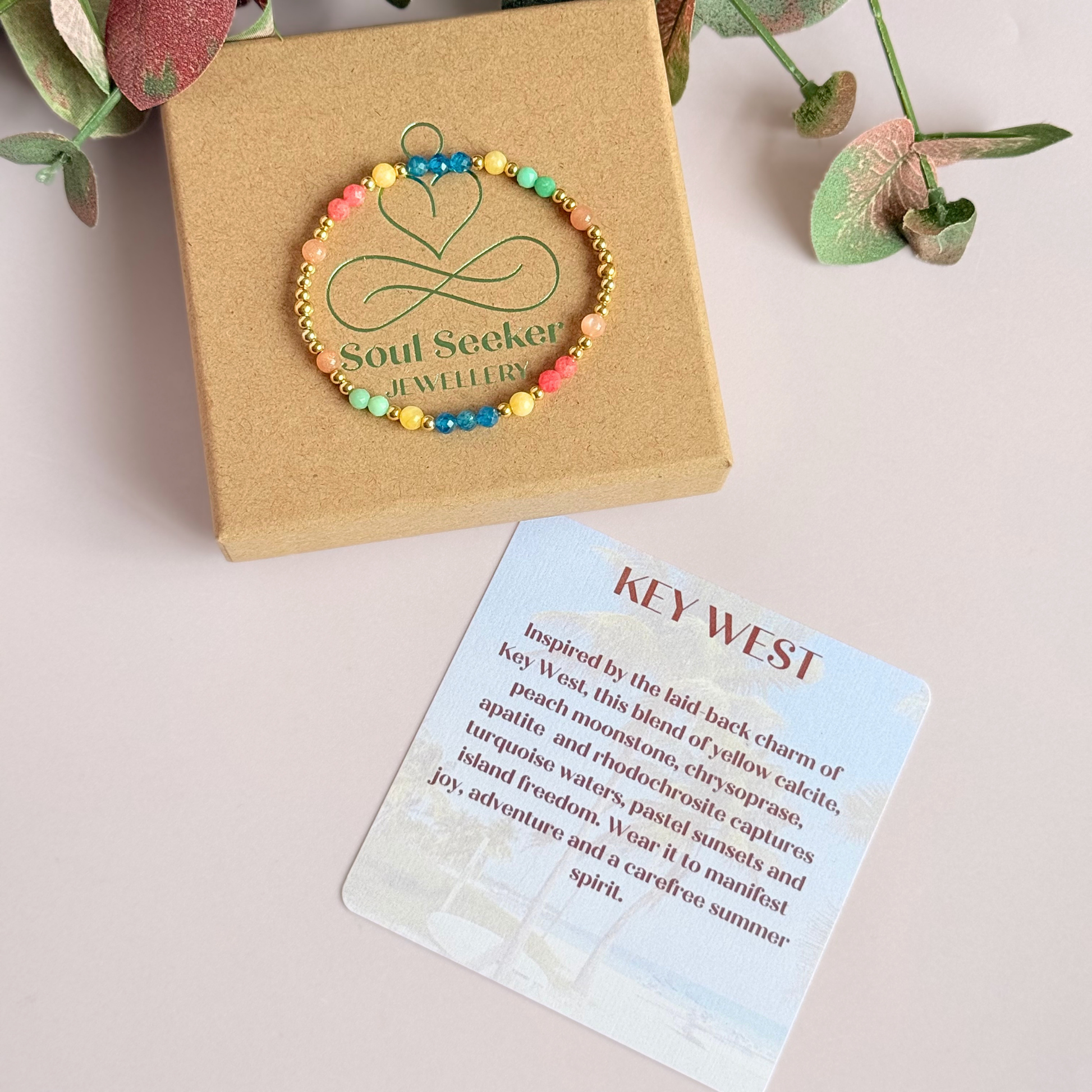 'Key West' gold vermeil dainty beaded bracelet with apatite, rhodochrosite, yellow calcite, chrysoprase and peach moonstone. Made with round 3mm gold vermeil beads and 4mm smooth and faceted round crystal gemstone beads. Pictured on the box, with the crystal information card