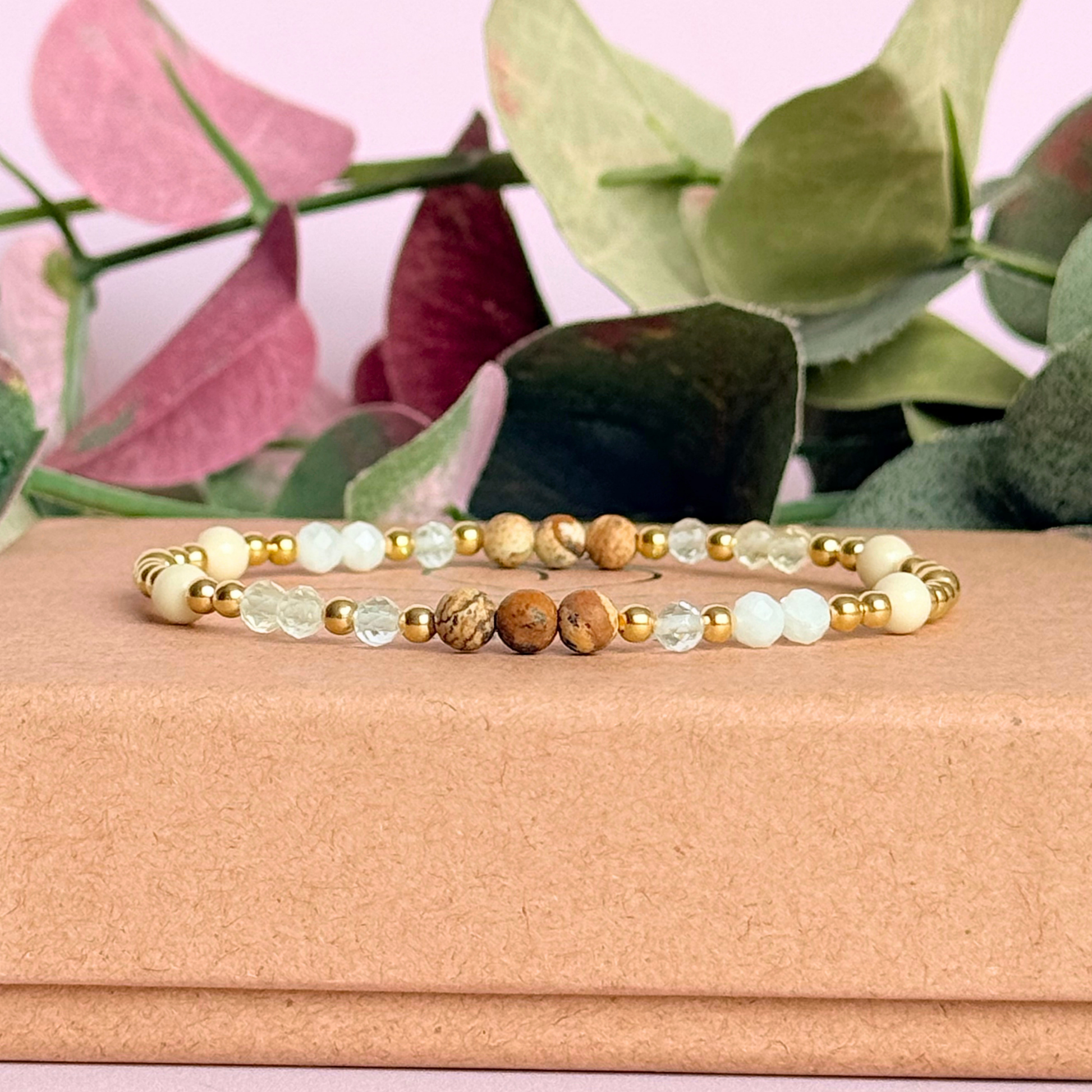'Ibiza Bohemia' gold vermeil dainty beaded bracelet with picture jasper, river stone jasper, citrine, clear quartz and moonstone. Made with round 3mm gold vermeil beads and 4mm smooth and faceted round crystal gemstone beads. Pictured on the gift box.