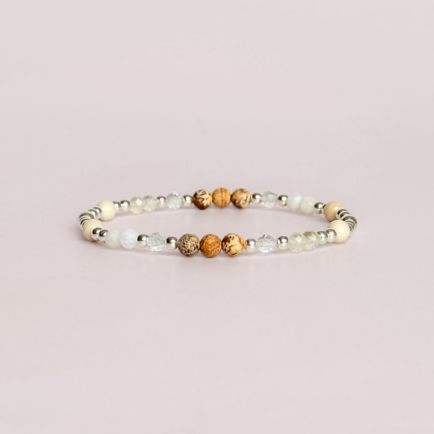 'Ibiza Bohemia' sterling silver dainty beaded bracelet with picture jasper, river stone jasper, citrine, clear quartz and moonstone. Made with round 3mm sterling silver beads and 4mm smooth and faceted round crystal gemstone beads. Pictured against a pink background