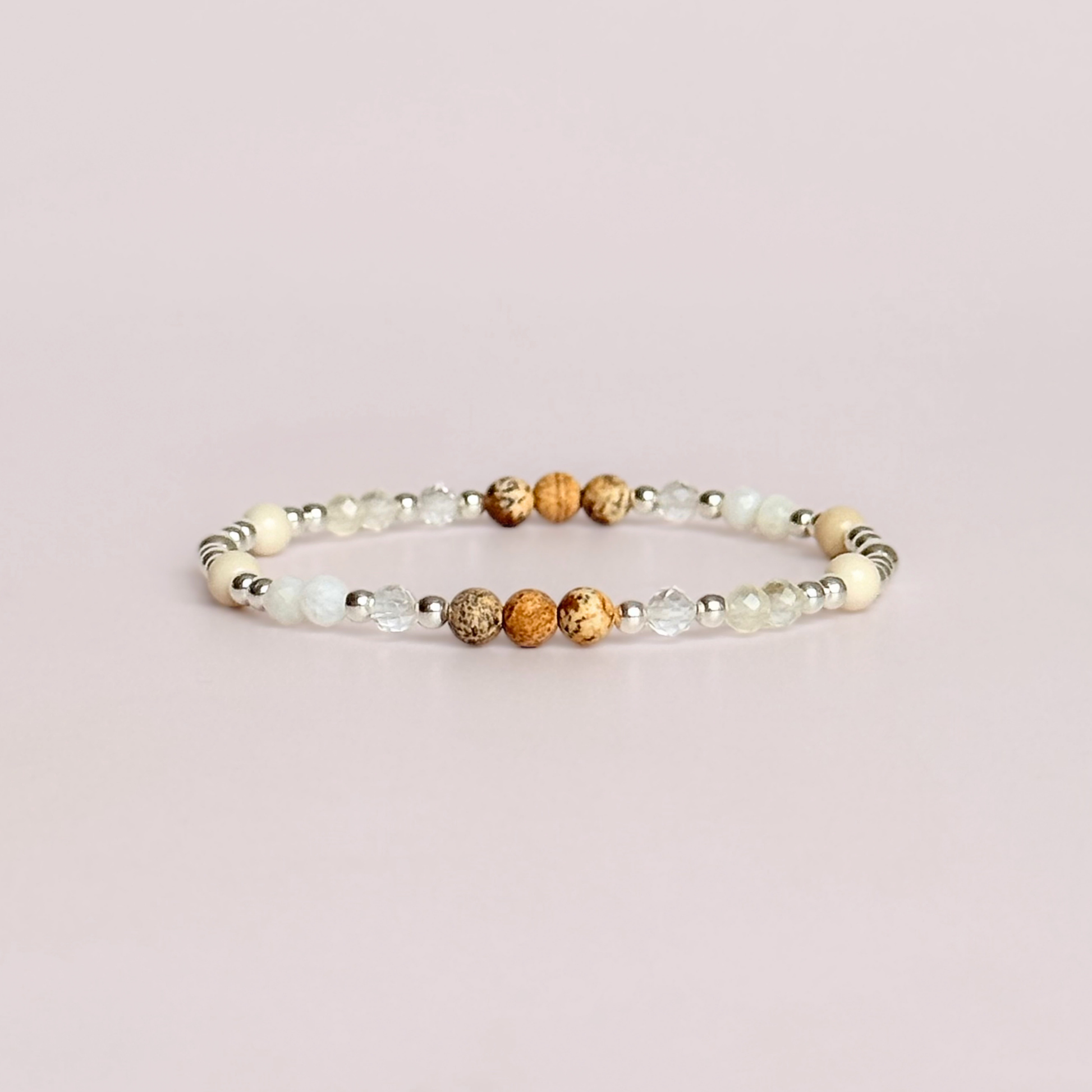 'Ibiza Bohemia' sterling silver dainty beaded bracelet with picture jasper, river stone jasper, citrine, clear quartz and moonstone. Made with round 3mm sterling silver beads and 4mm smooth and faceted round crystal gemstone beads. Pictured against a pink background