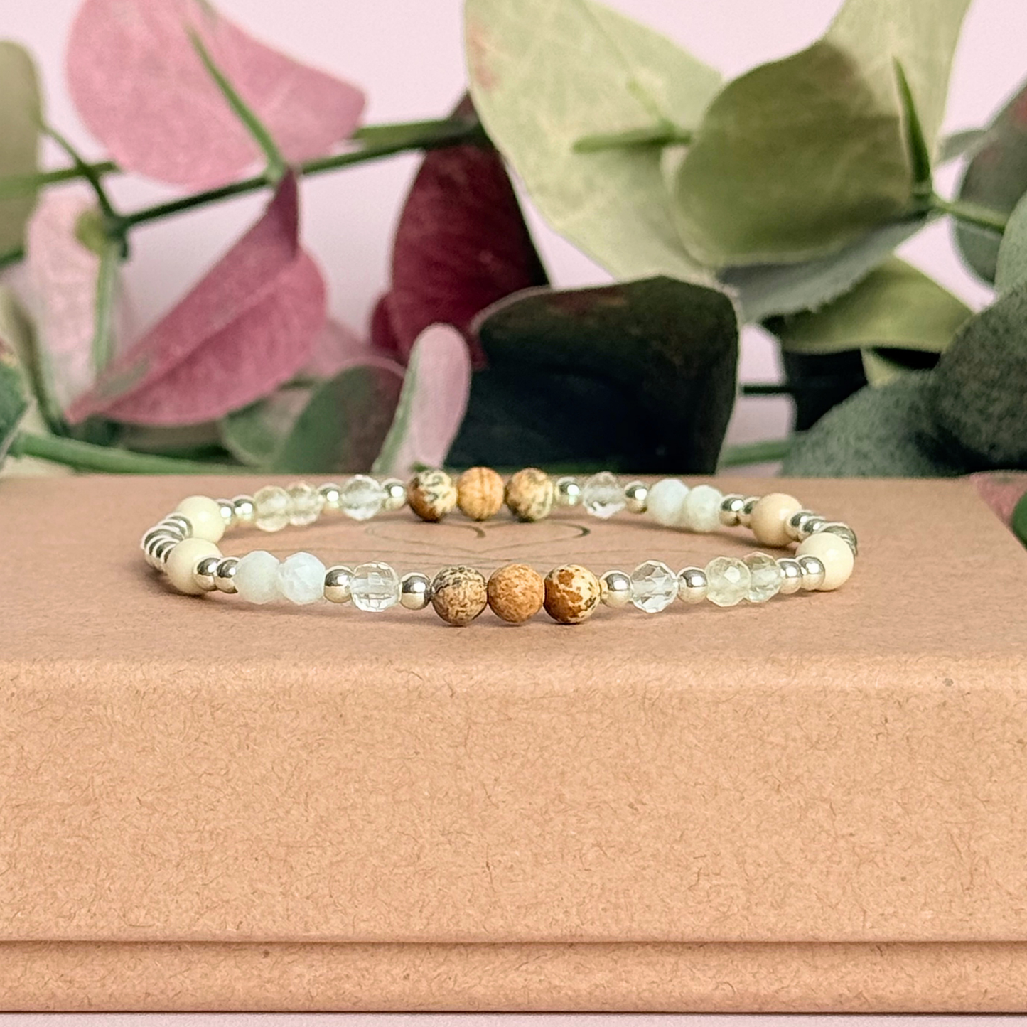 'Ibiza Bohemia' sterling silver dainty beaded bracelet with picture jasper, river stone jasper, citrine, clear quartz and moonstone. Made with round 3mm sterling silver beads and 4mm smooth and faceted round crystal gemstone beads. Pictured on top of the gift box