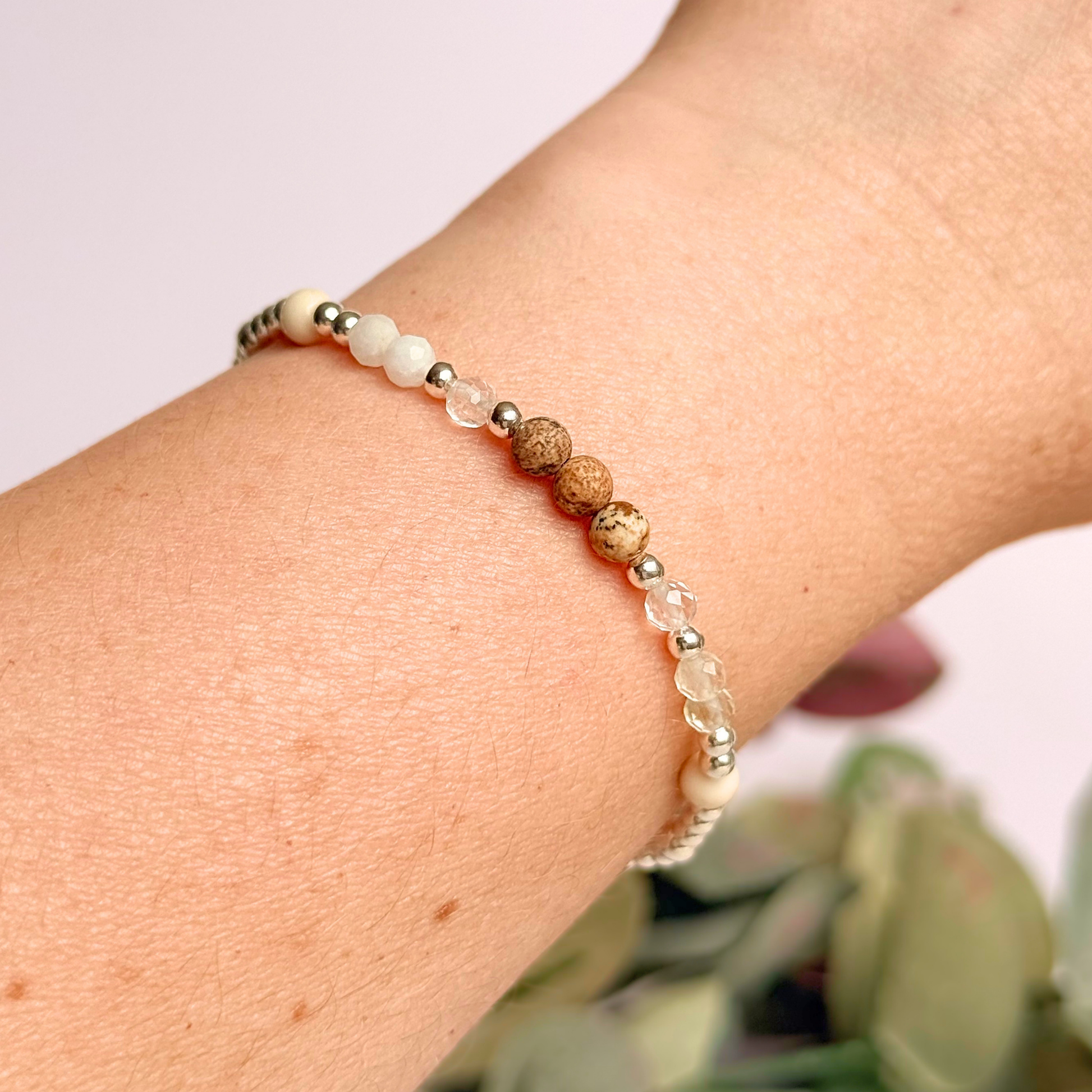 'Ibiza Bohemia' sterling silver dainty beaded bracelet with picture jasper, river stone jasper, citrine, clear quartz and moonstone. Made with round 3mm sterling silver beads and 4mm smooth and faceted round crystal gemstone beads. Pictured being worn.