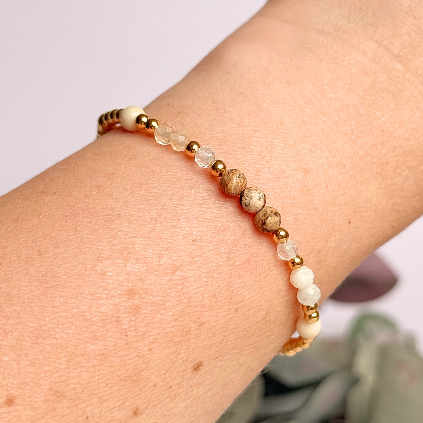 'Ibiza Bohemia' gold vermeil dainty beaded bracelet with picture jasper, river stone jasper, citrine, clear quartz and moonstone. Made with round 3mm gold vermeil beads and 4mm smooth and faceted round crystal gemstone beads. Pictured being worn.