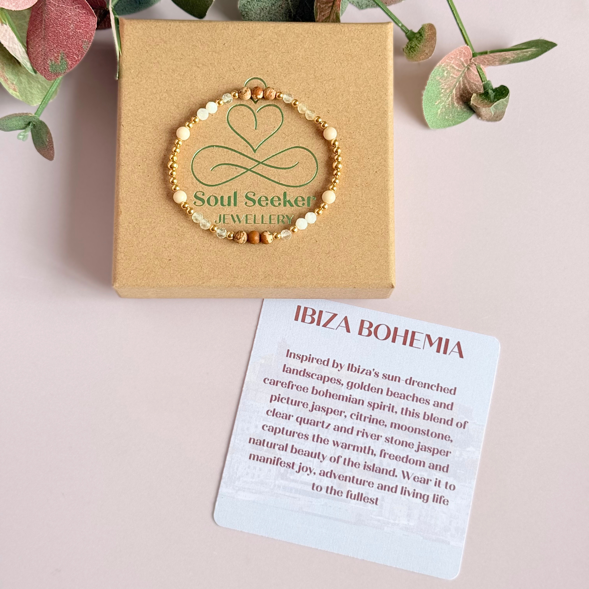 'Ibiza Bohemia' gold vermeil dainty beaded bracelet with picture jasper, river stone jasper, citrine, clear quartz and moonstone. Made with round 3mm gold vermeil beads and 4mm smooth and faceted round crystal gemstone beads. Pictured on the gift box, with the crystal information card.