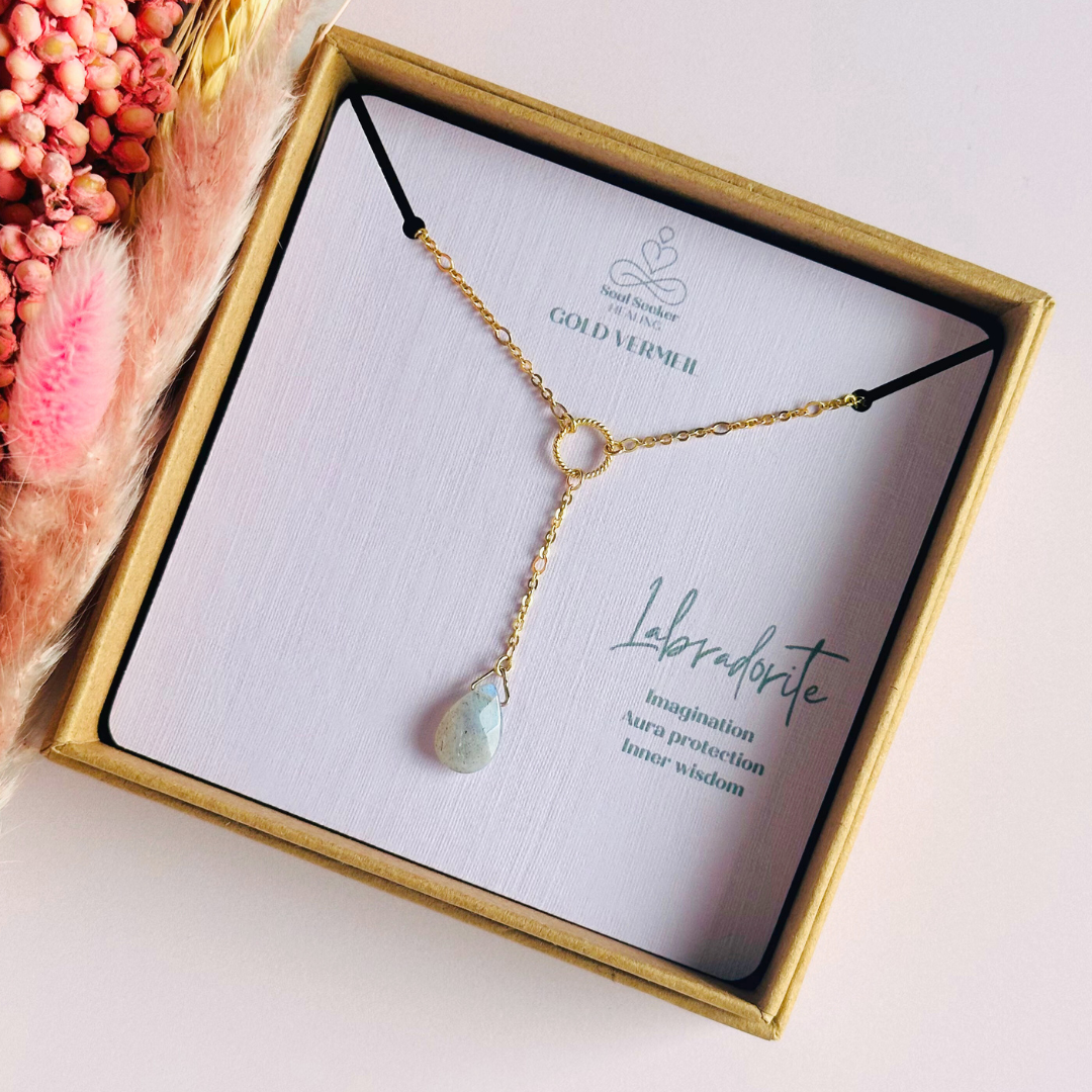 Labradorite necklace featuring a faceted labradorite teardrop bead on a delicate gold vermeil figaro chain with a twisted gold vermeil ring focal point. The necklace fastens with a subtle yet secure gold vermeil bolt clasp. The teardrop bead measures 12mm x 8mm.