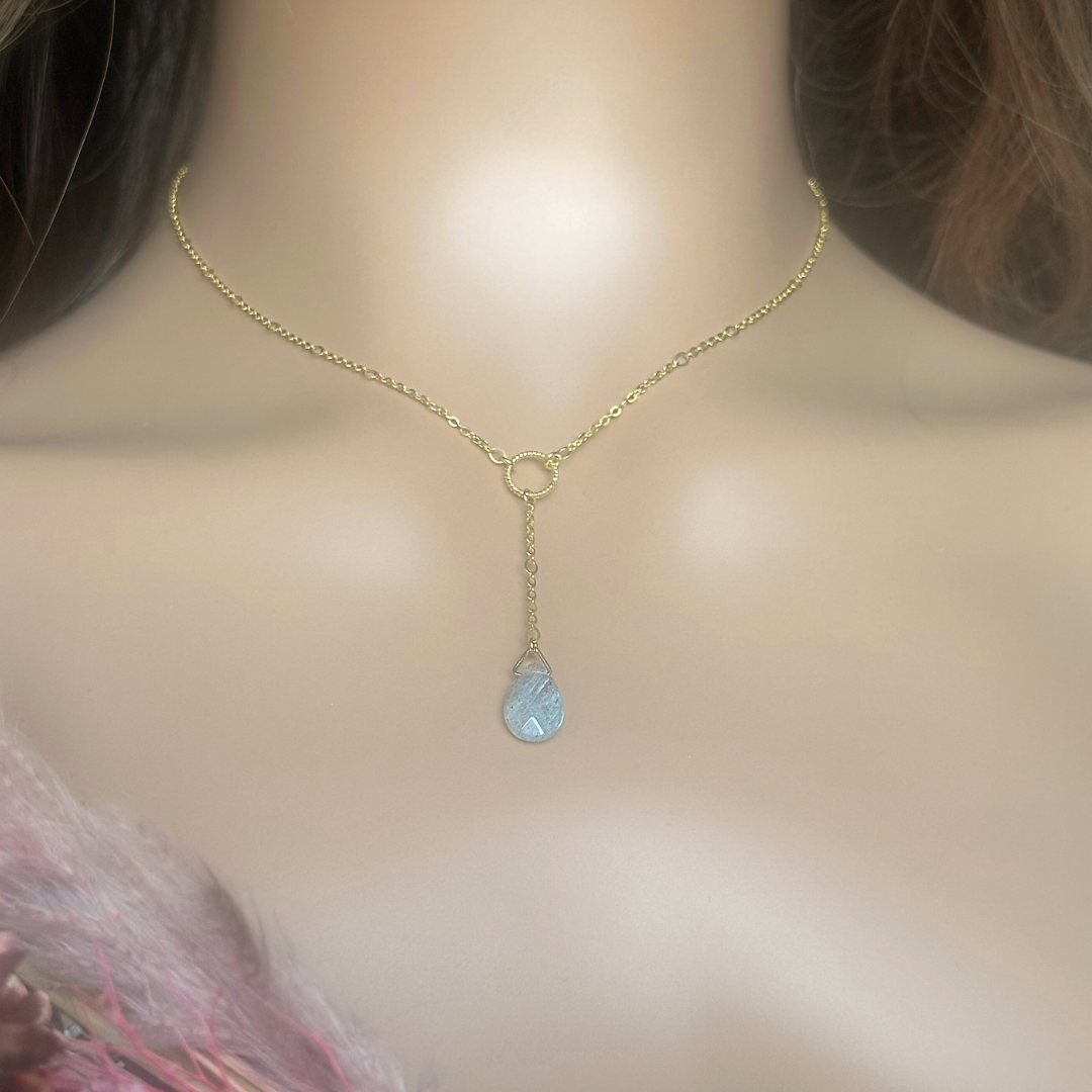 Labradorite necklace featuring a faceted labradorite teardrop bead on a delicate gold vermeil figaro chain with a twisted gold vermeil ring focal point. The necklace fastens with a subtle yet secure gold vermeil bolt clasp. The teardrop bead measures 12mm x 8mm.