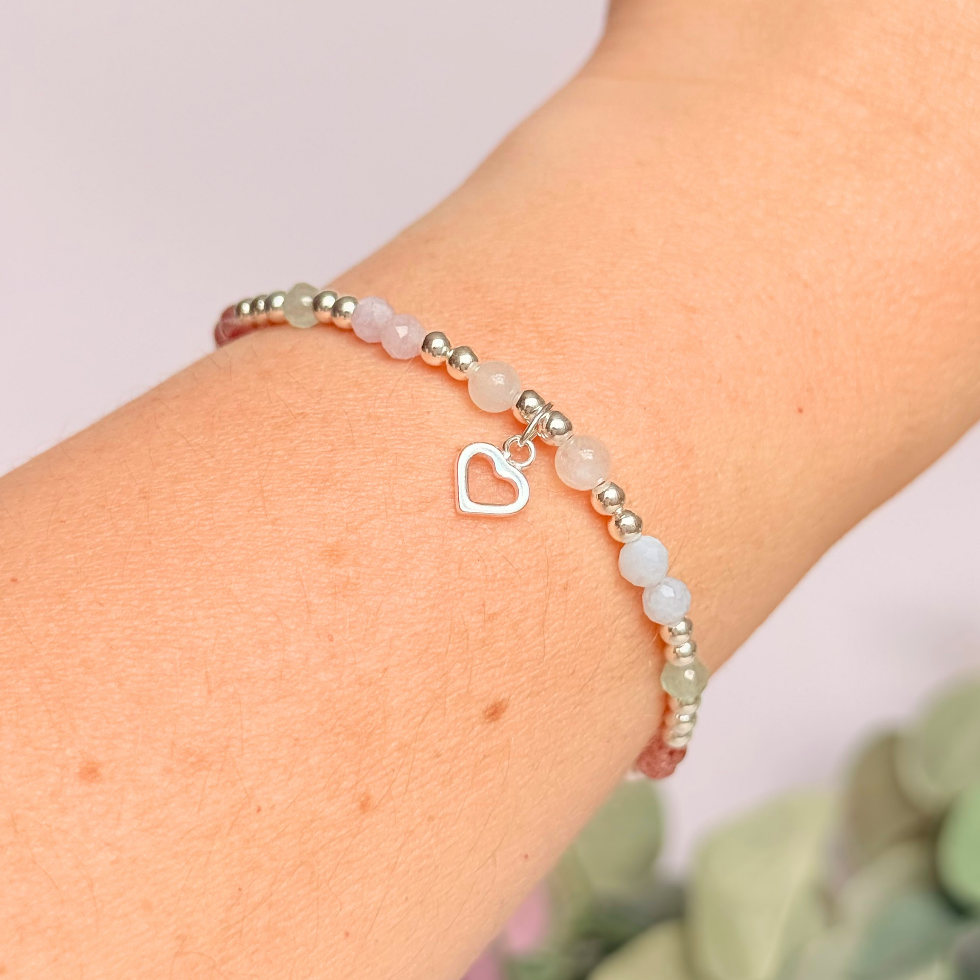 'Soft girl summer' sterling silver dainty beaded bracelet with Kunzite, moonstone, green aventurine, blue lace agate and strawberry quartz . With a beautiful open heart charm.Made with round 3mm sterling silver beads and 4mm smooth and faceted round crystal gemstone beads. Pictured being worn