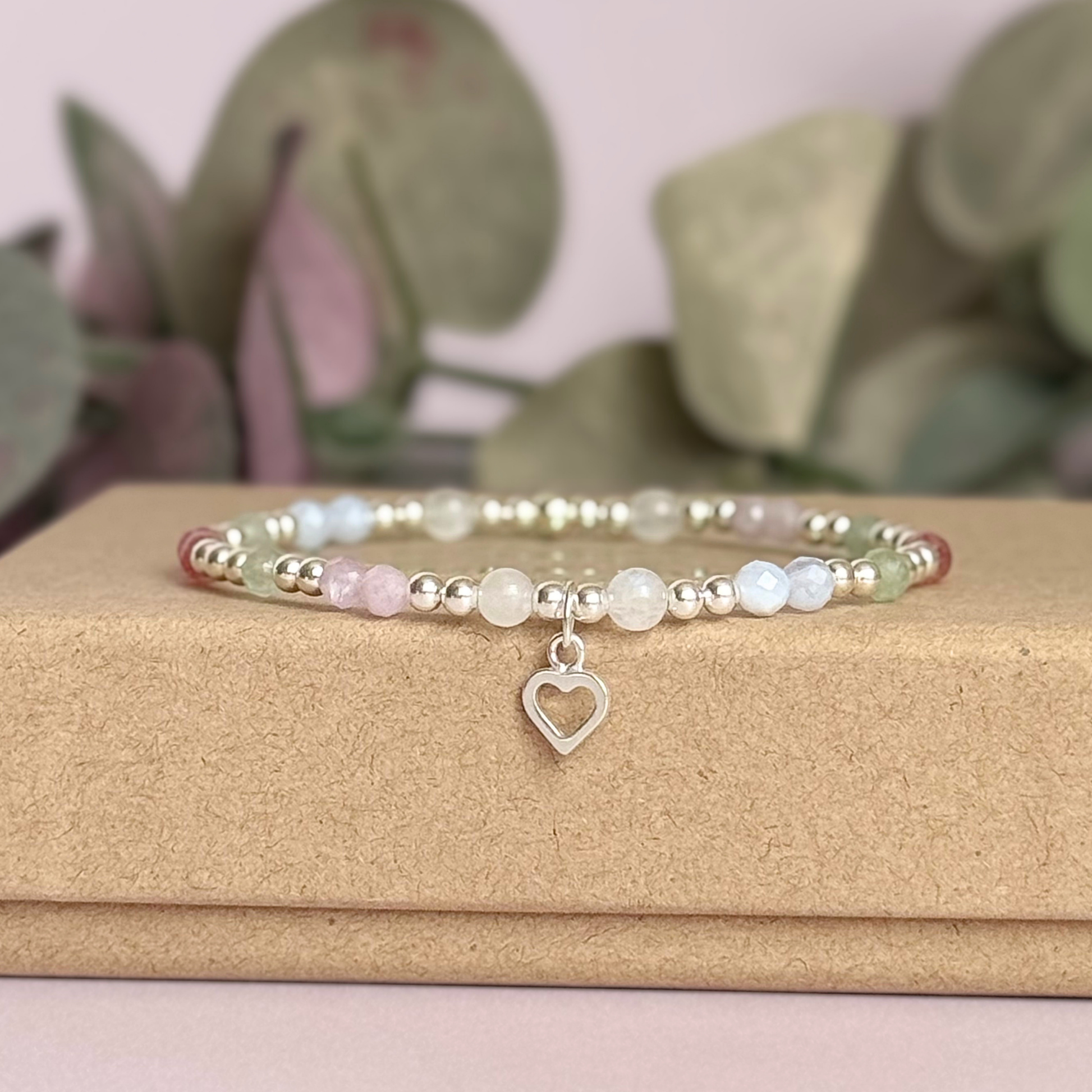 'Soft girl summer' sterling silver dainty beaded bracelet with Kunzite, moonstone, green aventurine, blue lace agate and strawberry quartz . With a beautiful open heart charm.Made with round 3mm sterling silver beads and 4mm smooth and faceted round crystal gemstone beads. Pictured on the gift box
