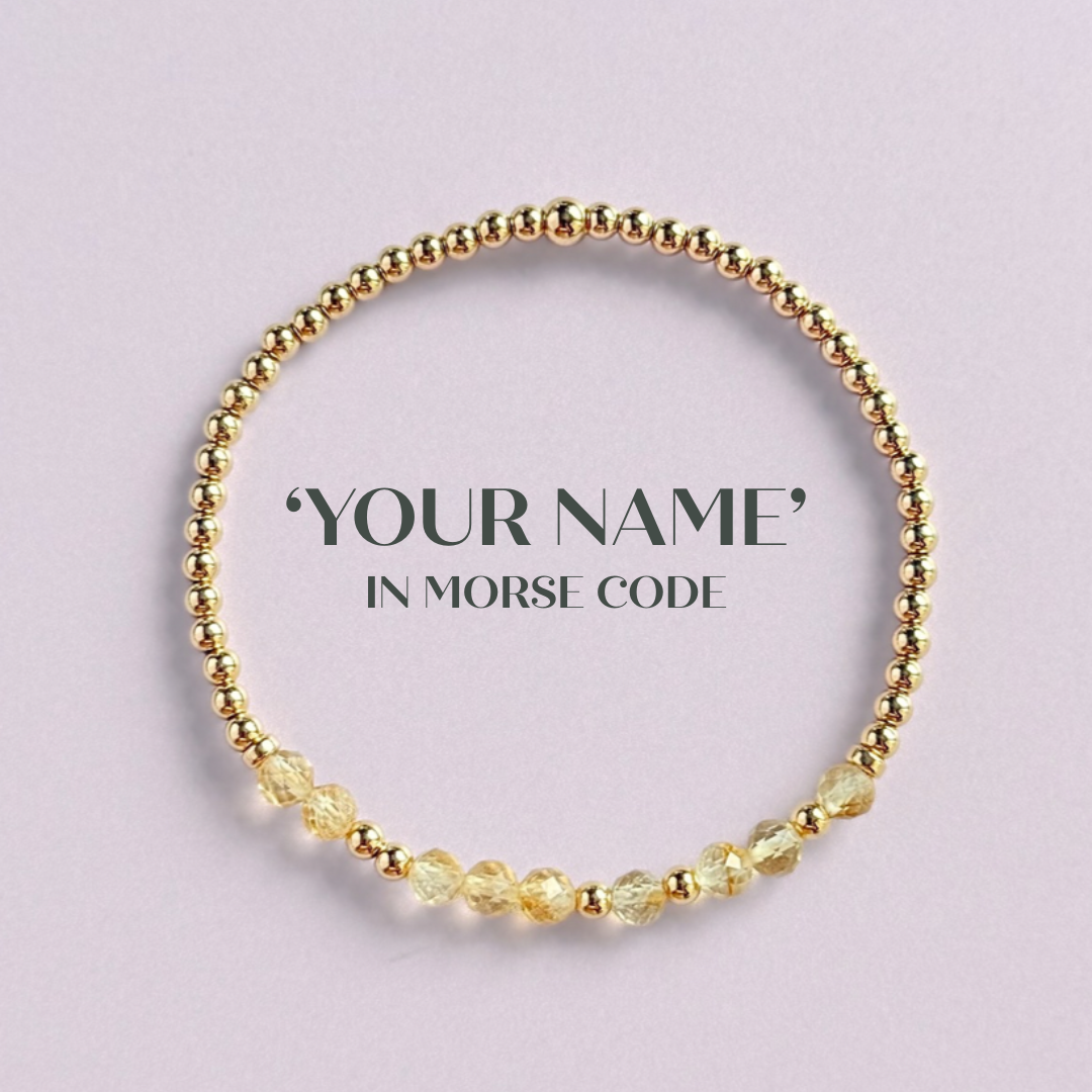 Morse code secret message bracelet spelling out your chosen name in gold filled and citrine crystal beads. Elasticated with 4mm faceted citrine beads and 3mm gold filled beads. Custom November birthstone bracelet.