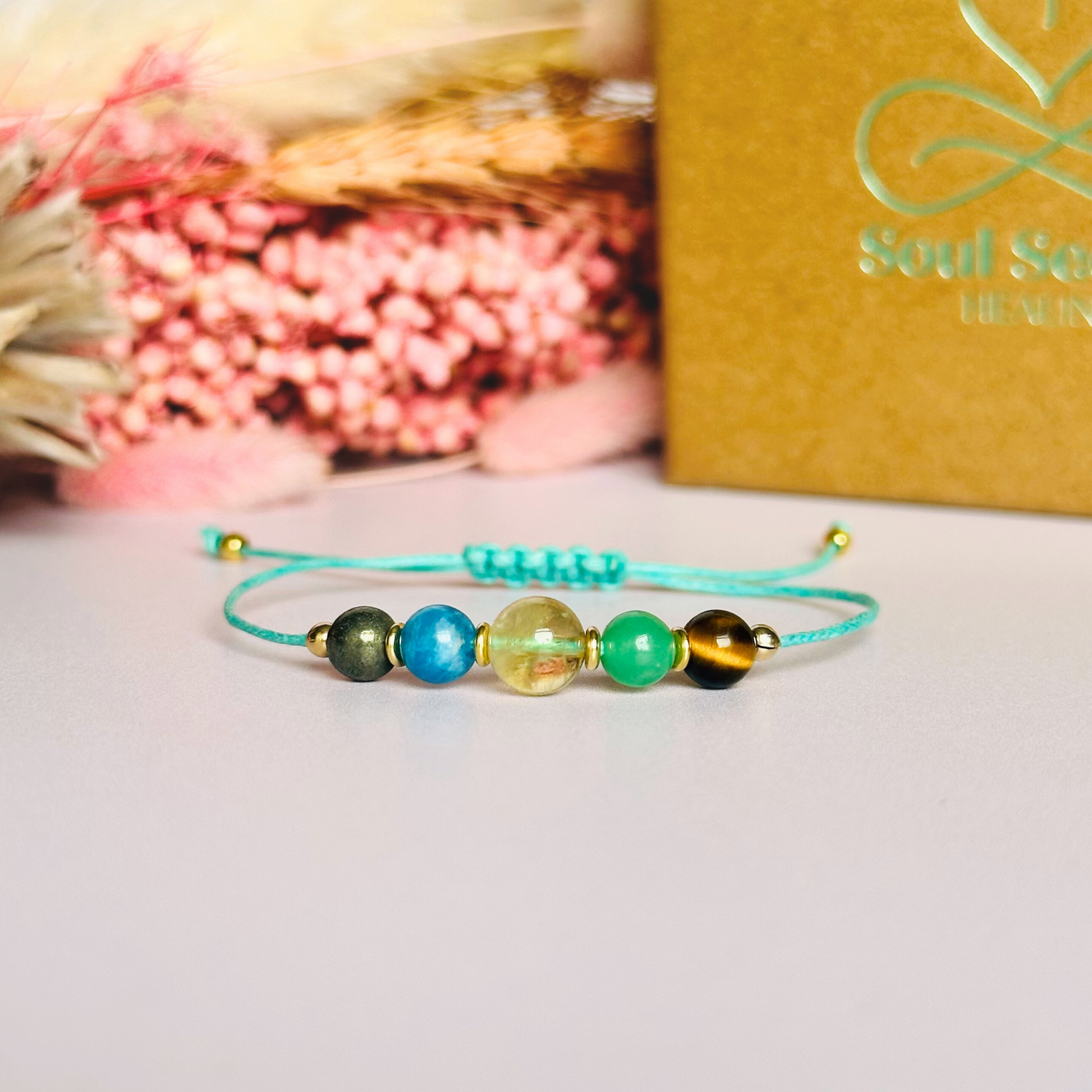 Manifesting crystal healing bracelet made with the tigers eye, green aventurine, citrine, apatite and pyrite. Strung on an eco and vegan friendly waxed cotton cord and finished with your choice of sterling silver, rose gold vermeil or gold vermeil accent beads. A sliding macramé clasp makes it adjustable.