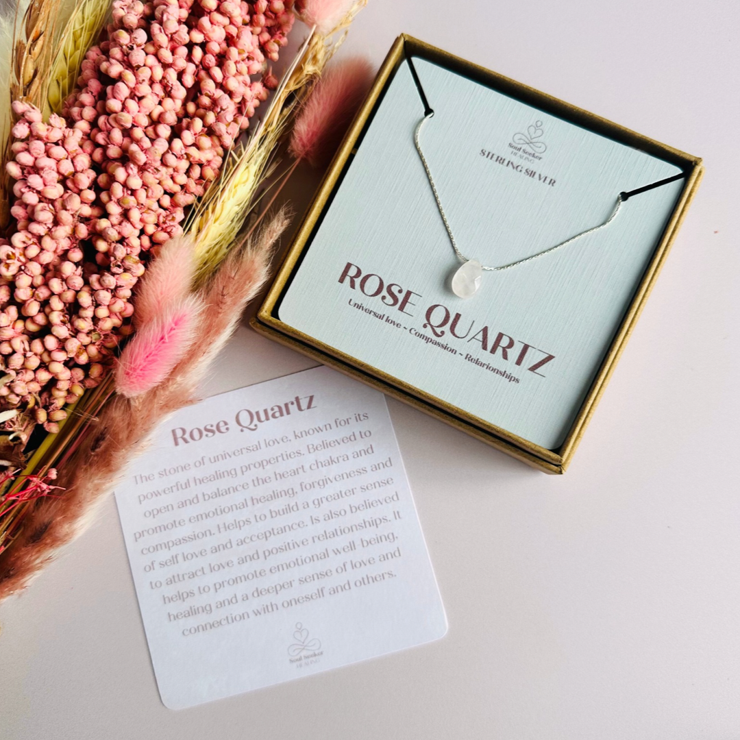 Dainty rose quartz teardrop necklace featuring a 12x8mm faceted rose quartz teardrop bead on a fine sterling silver beading chain.