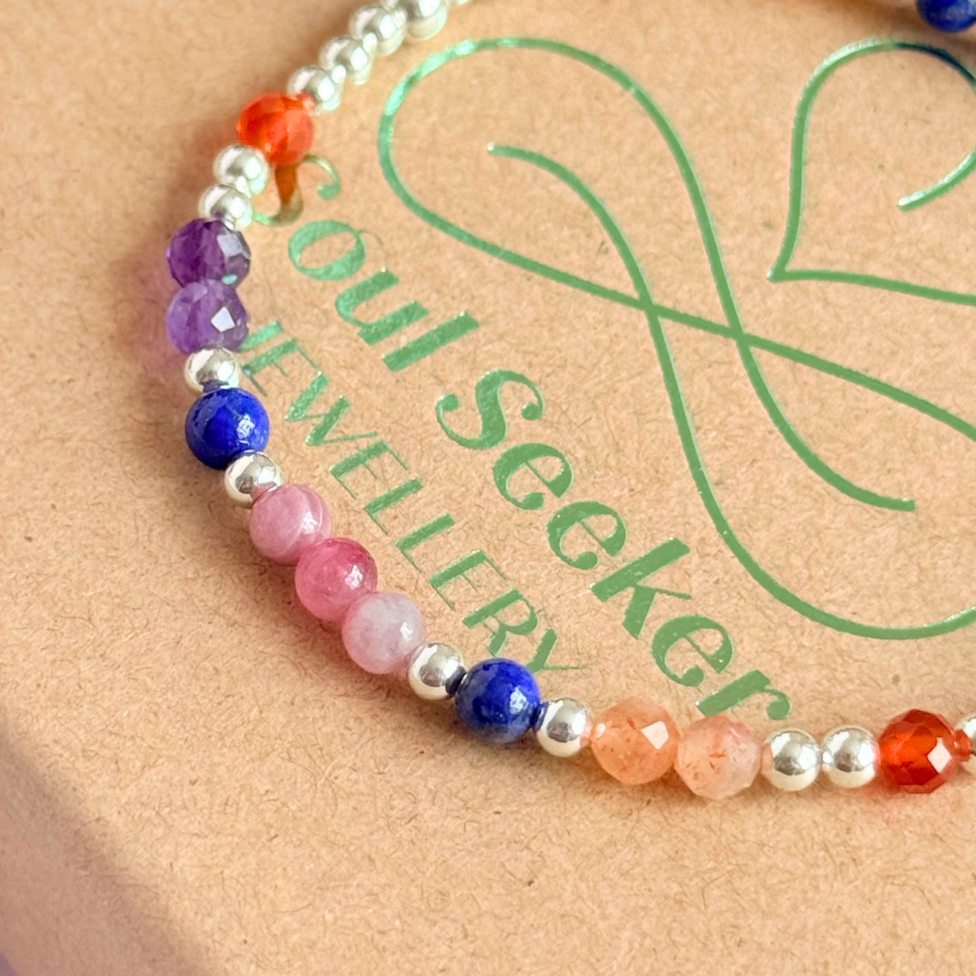 ‘Arabian Sunset' sterling silver dainty beaded bracelet with pink tourmaline, sunstone, carnelian, lapis lazuli and amethyst. Made with round 3mm sterling silver beads and 4mm smooth and faceted round crystal gemstone beads. Pictured on the gift box, close up