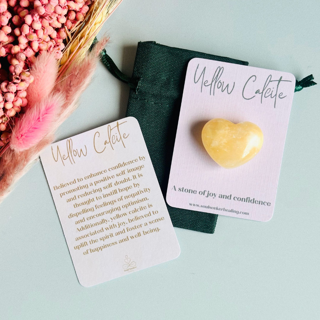A beautiful ethically mined yellow calcite heart, presented on an eco-friendly textured card with the words 'A stone of joy and confidence.' This heart shaped crystal measures approximately 25mm x 25mm.