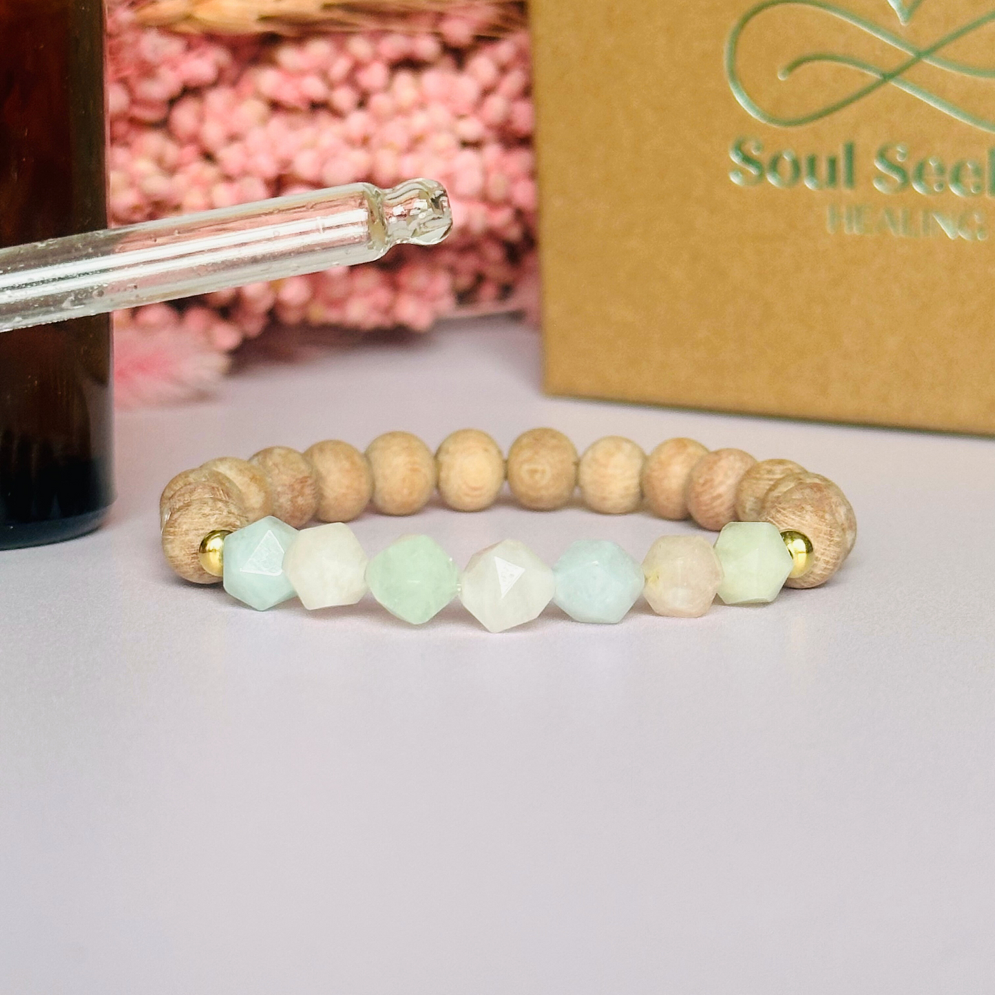 Morganite and raw rosewood elasticated essential oil diffuser bracelet. Made with 8mm star cut morganite beads, 8mm round raw rosewood beads and your choice of sterling silver, gold vermeil or rose gold vermeil spacer beads