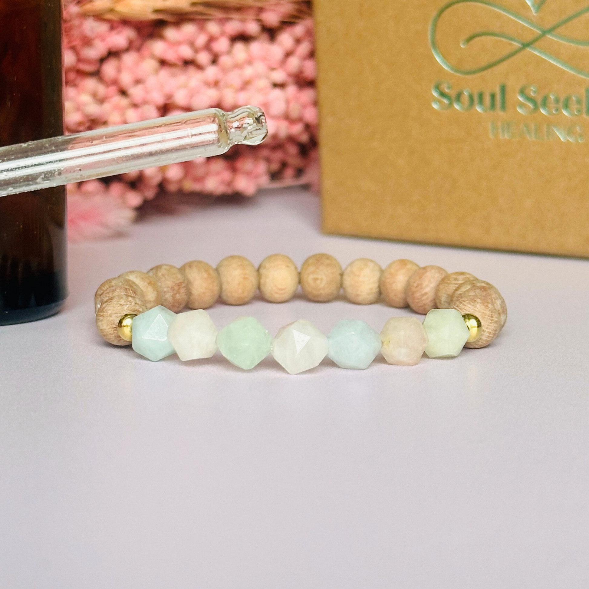 Morganite and raw rosewood elasticated essential oil diffuser bracelet. Made with 8mm star cut morganite beads, 8mm round raw rosewood beads and your choice of sterling silver, gold vermeil or rose gold vermeil spacer beads