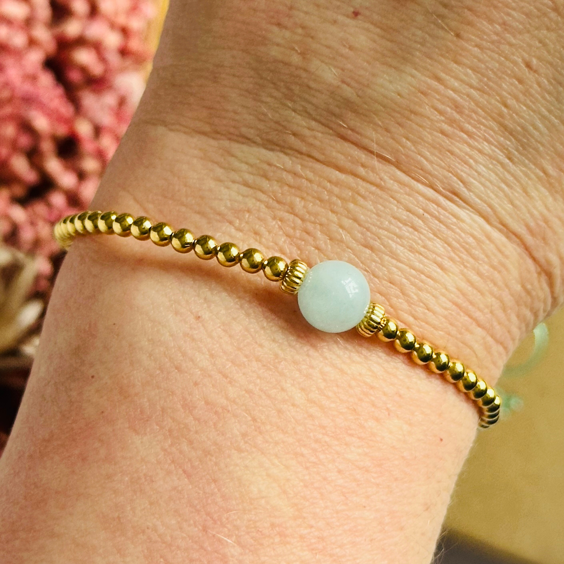 Gold vermeil aquamarine bracelet features an ethically mined 8mm aquamarine bead, flanked by corrugated rondelle beads on a band of 3mm gold vermeil beads. A bracelet to promote courage and self expression.