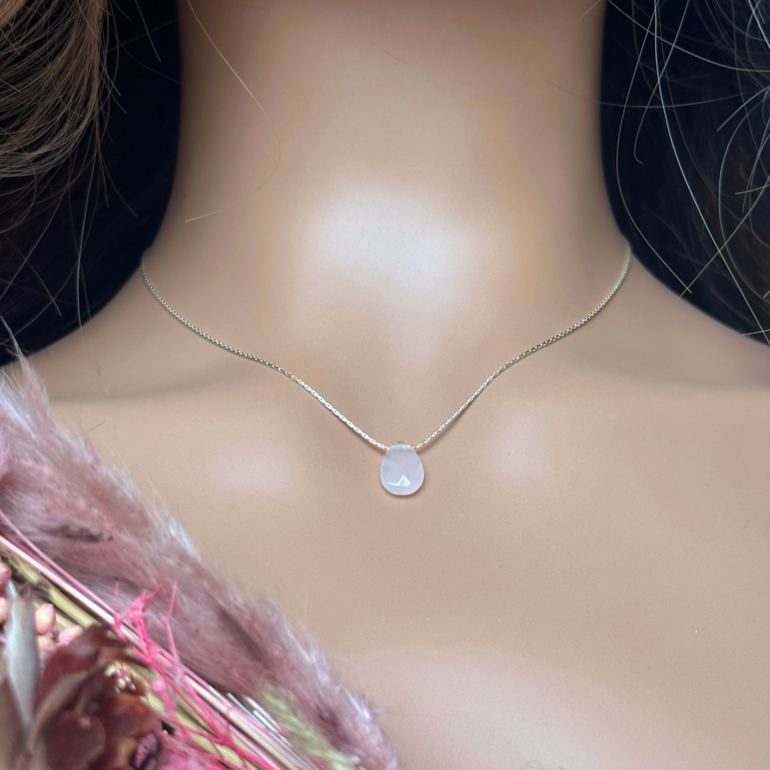 Dainty rose quartz teardrop necklace featuring a 12x8mm faceted rose quartz teardrop bead on a fine sterling silver beading chain.