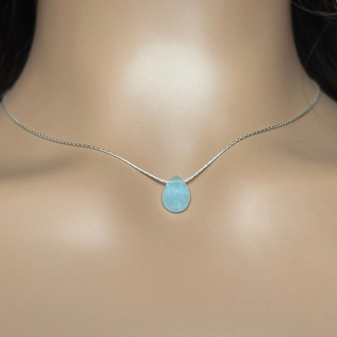 Dainty aquamarine teardrop necklace featuring a 12x8mm faceted aquamarine teardrop bead on a fine sterling silver cardano beading chain.