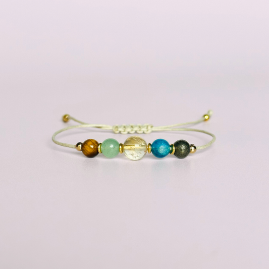 Manifesting crystal healing bracelet made with the tigers eye, green aventurine, citrine, apatite and pyrite. Strung on an eco and vegan friendly waxed cotton cord and finished with your choice of sterling silver, rose gold vermeil or gold vermeil accent beads. A sliding macramé clasp makes it adjustable.