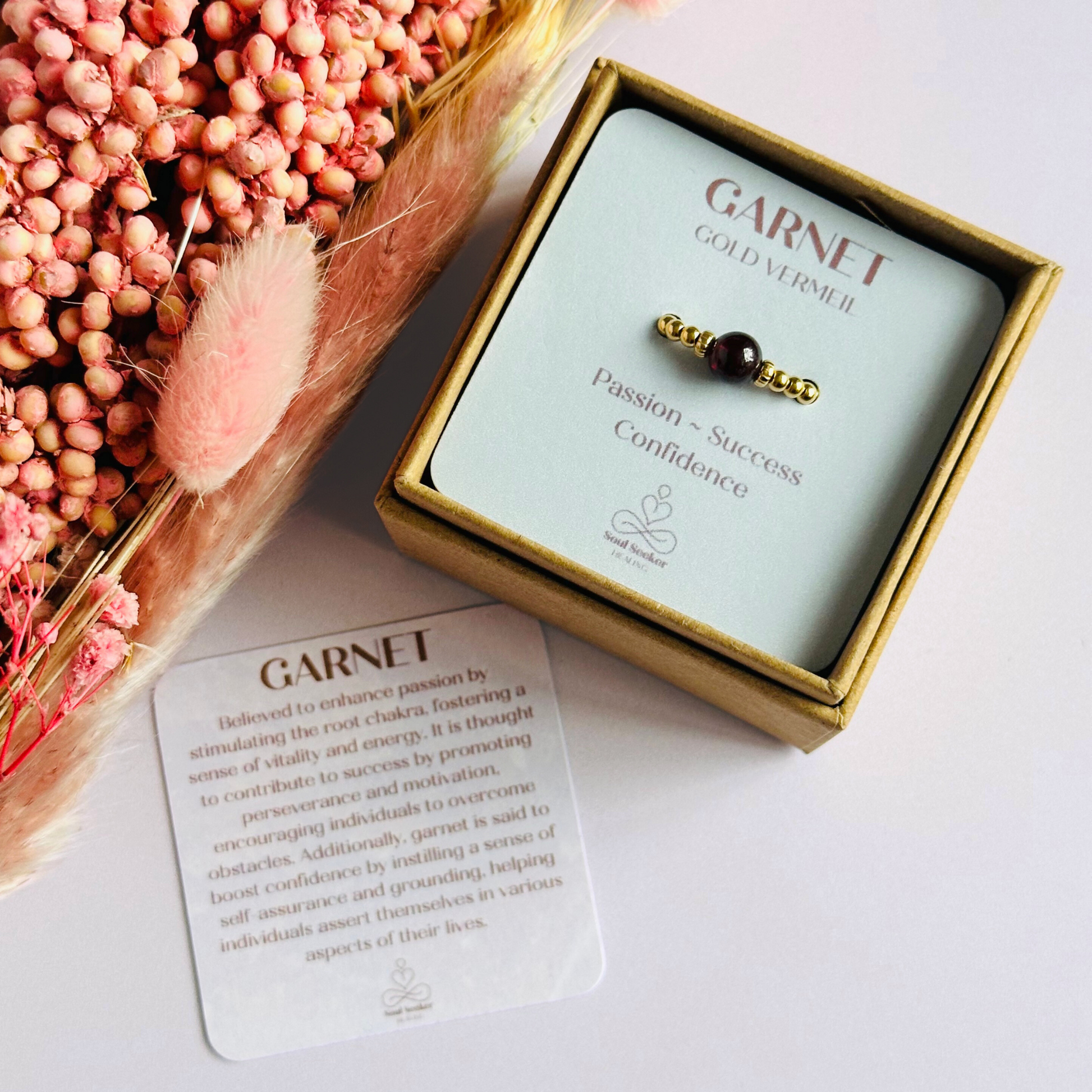 Gold vermeil garnet ring featuring a 6mm smooth round garnet bead on a elasticated ring band of 2.5mm gold vermeil beads.