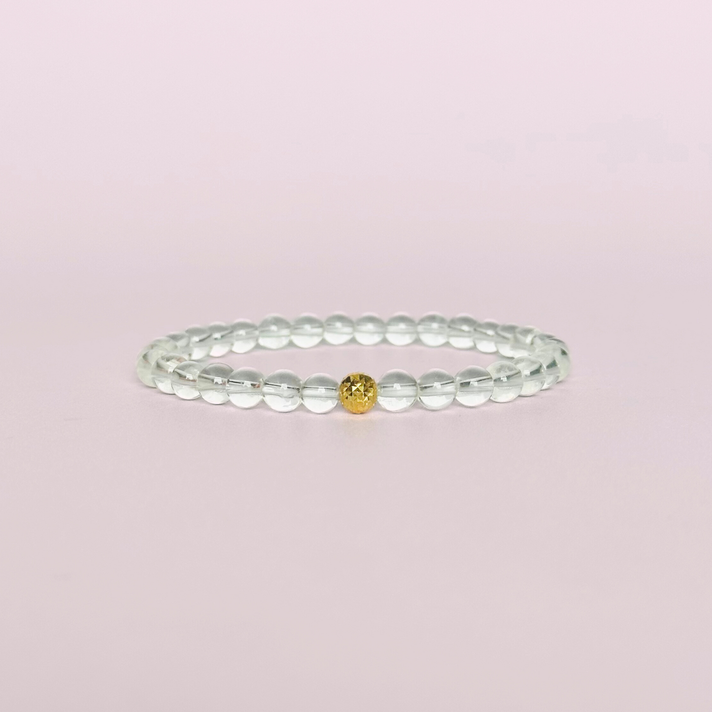 Clear quartz bracelet featuring 6mm round clear quartz beads with either a sterling silver or gold vermeil faceted focal bead￼