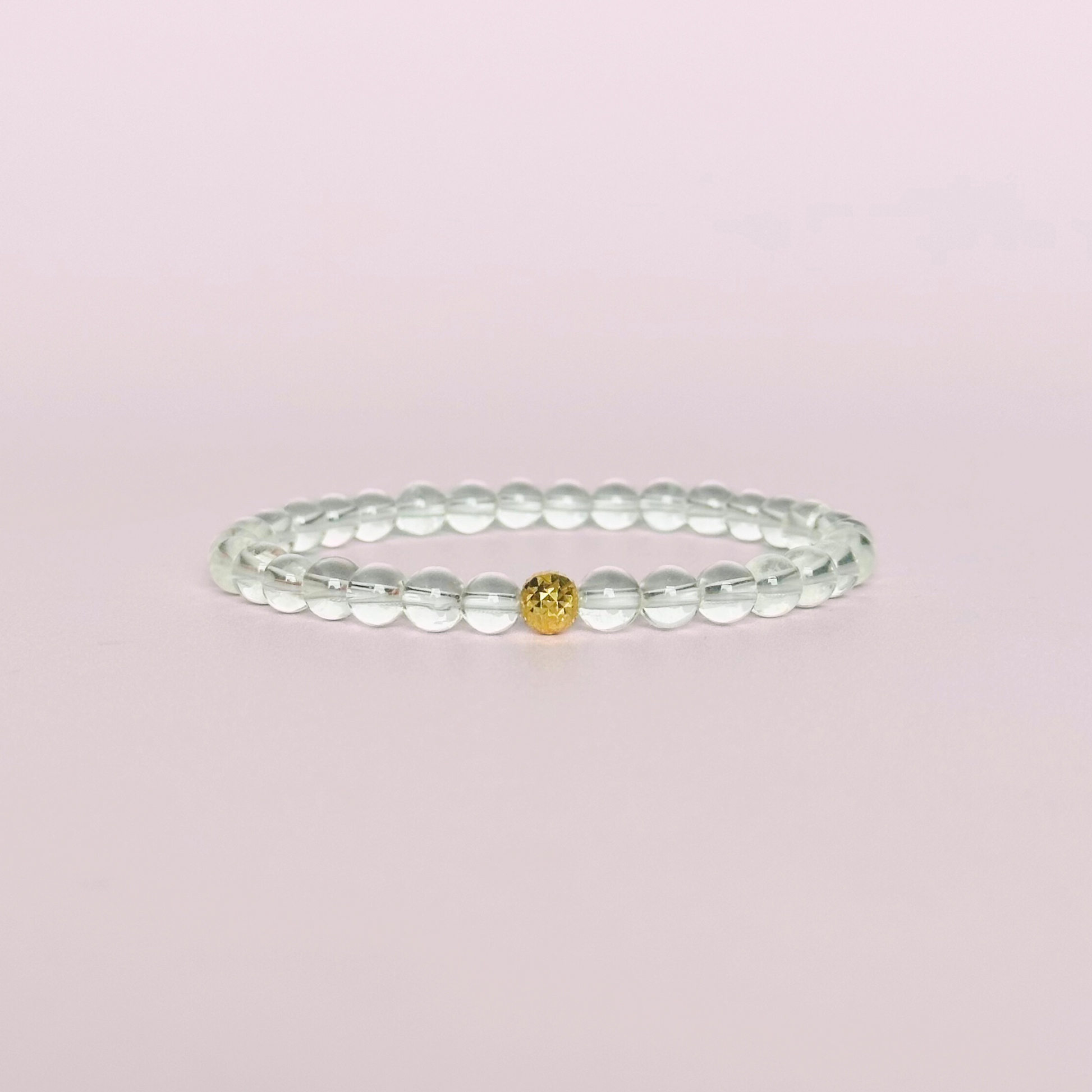 Clear quartz bracelet featuring 6mm round clear quartz beads with either a sterling silver or gold vermeil faceted focal bead￼