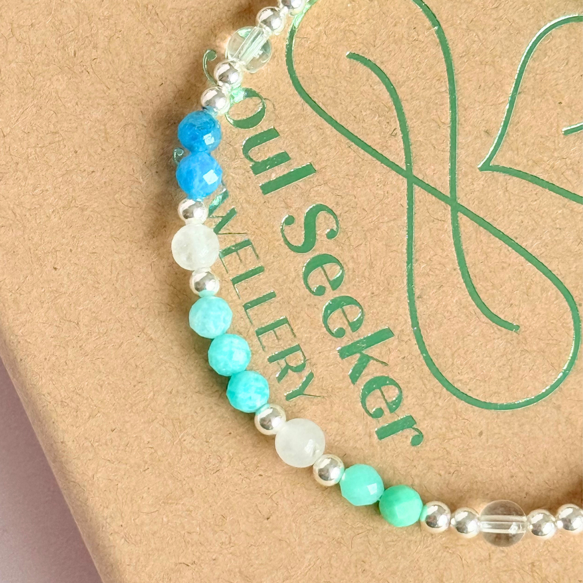 ‘Caribbean Dream' sterling silver dainty beaded bracelet with white jade, chrysoprase, amazonite, apatite and clear quartz. Made with round 3mm sterling silver beads and 4mm smooth and faceted round crystal gemstone beads. Pictured on top of the box, close up