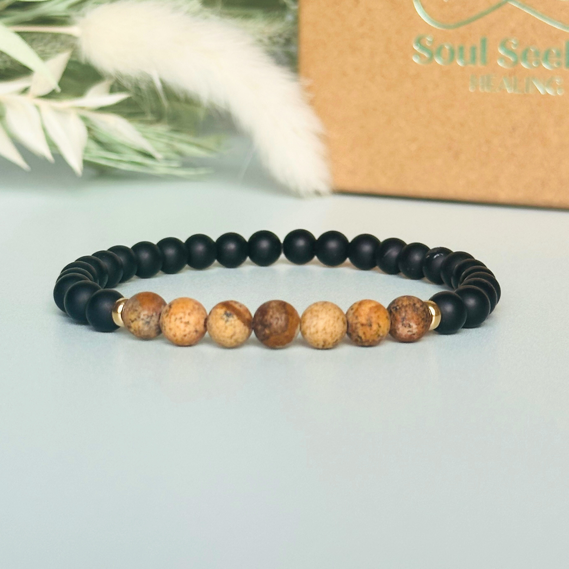 Men’s crystal bracelet featuring 6mm matte black onyx beads, 6mm matte picture jasper beads with gold vermeil spacer beads.