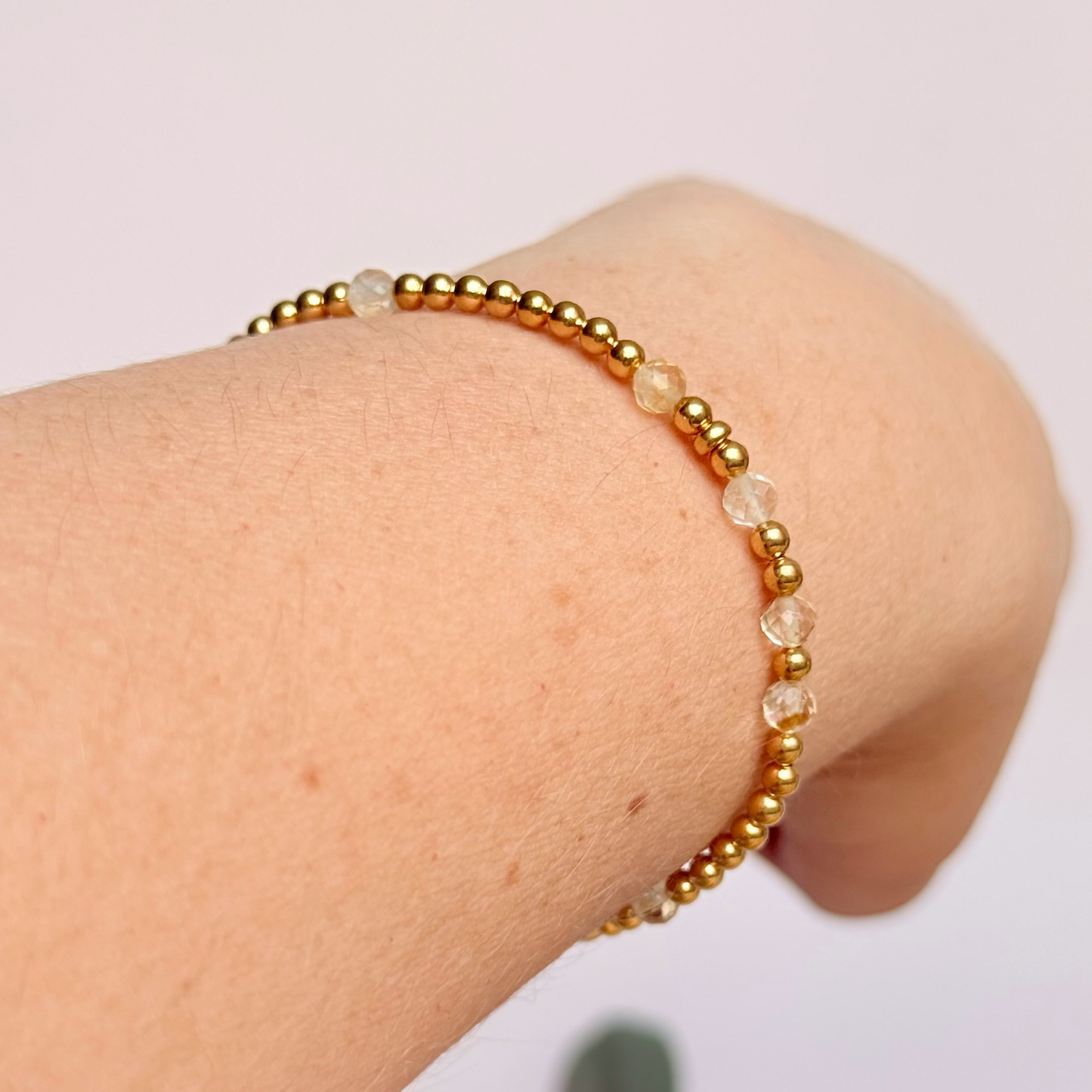 Citrine morse code bracelet that spells out the words ‘Ask, believe, receive’ in a combination of 4mm round smooth and faceted crystal beads with your choice of sterling silver or gold vermeil accent beads. Pictured being worn, in gold