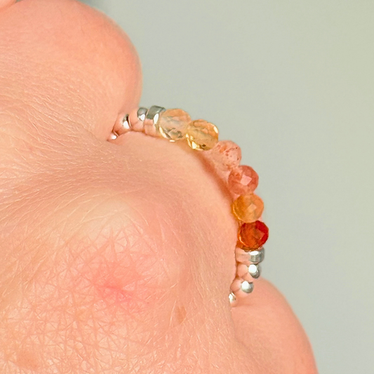 Sterling silver band style ombré ring with multicolour gradient 3mm faceted citrine, sunstone and carnelian beads with a beaded band of 2.5 mm sterling silver round beads. Elasticated for comfort.