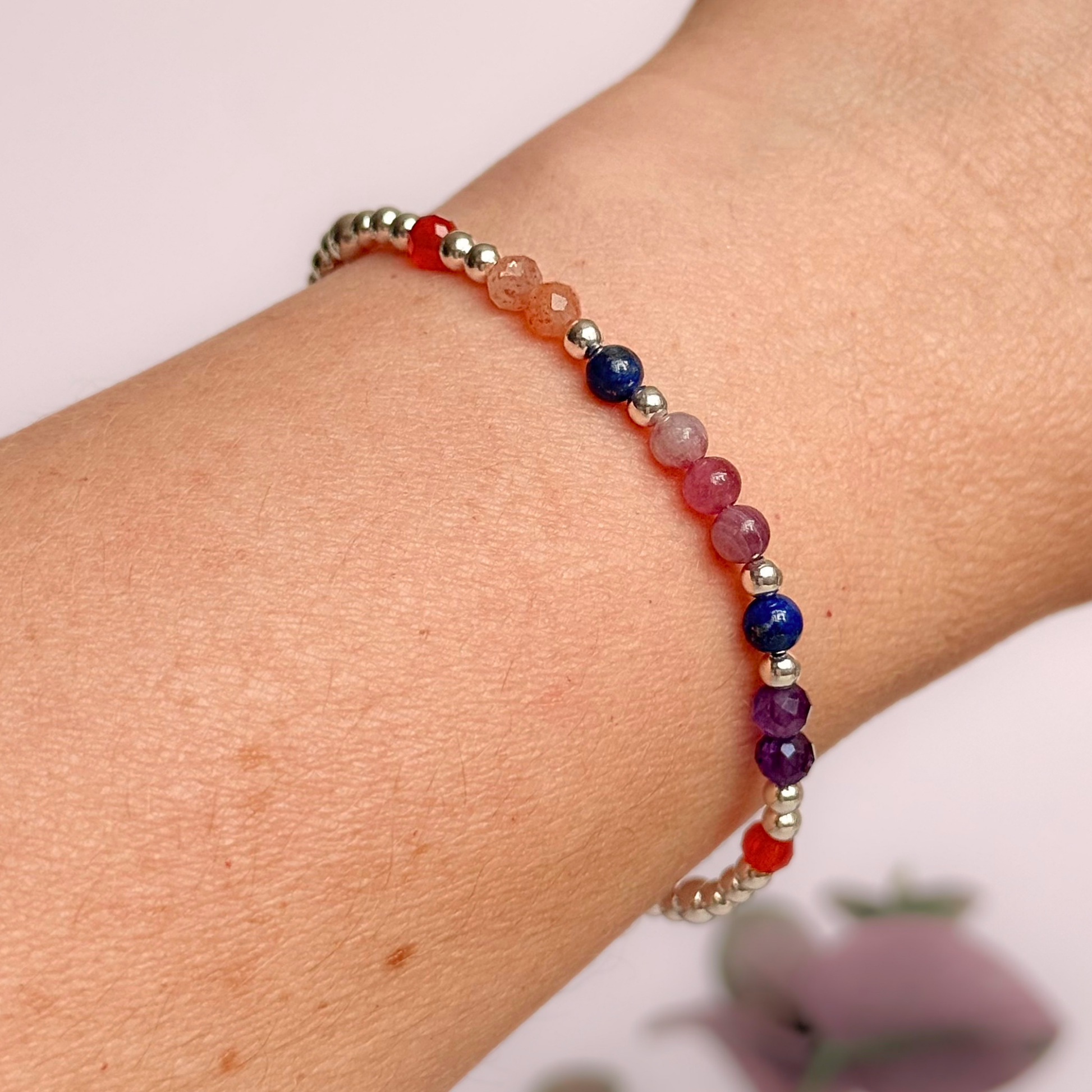 ‘Arabian Sunset' sterling silver dainty beaded bracelet with pink tourmaline, sunstone, carnelian, lapis lazuli and amethyst. Made with round 3mm sterling silver beads and 4mm smooth and faceted round crystal gemstone beads. Pictured being worn 