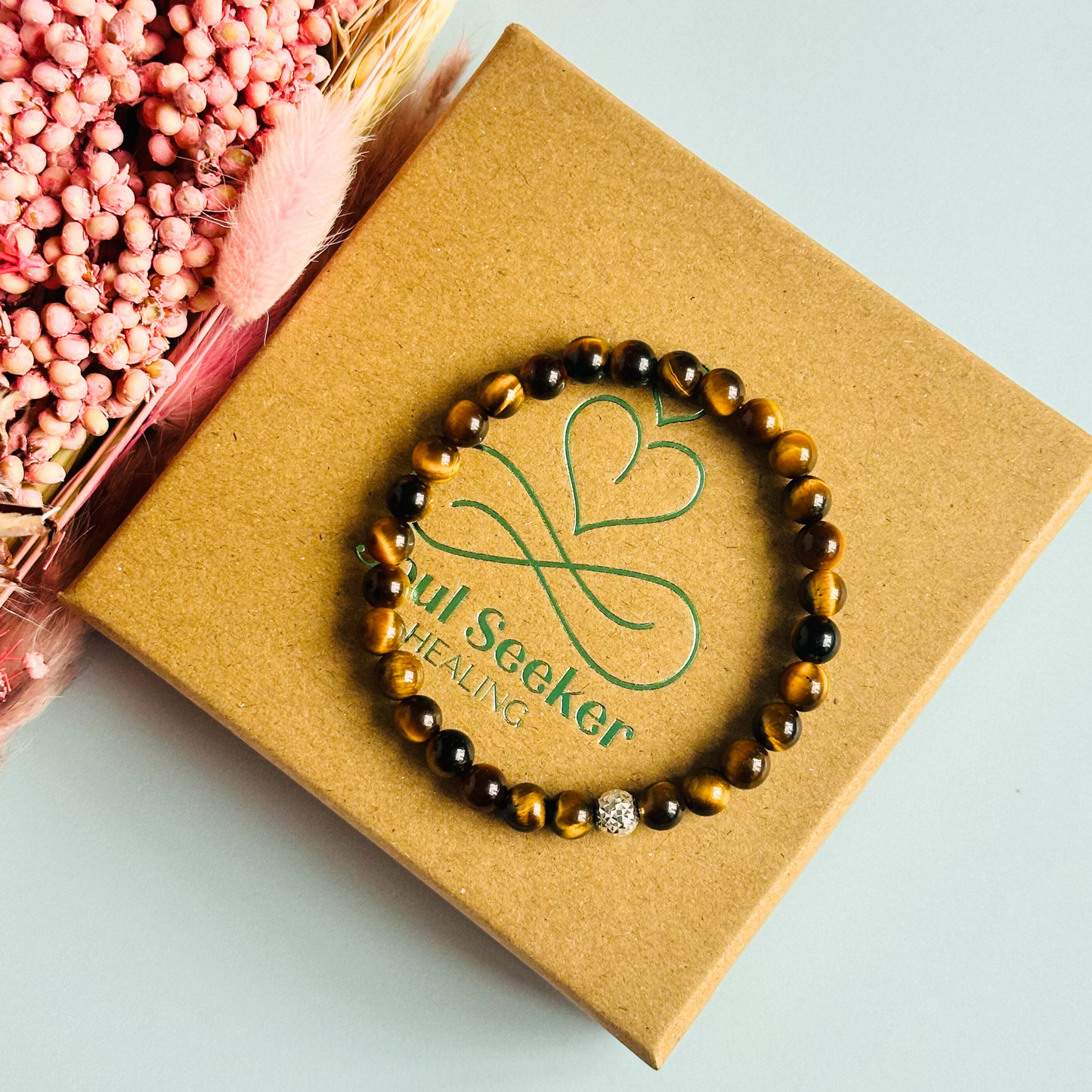 Tigers Eye bracelet featuring 6mm smooth tiger eye beads. With your choice of gold vermeil or sterling silver faceted accent beats.