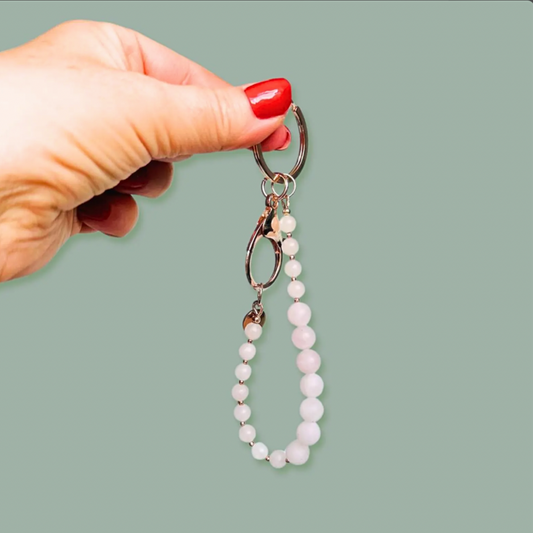 Frosted rose quartz breath work beads on a rose gold plated keychain/bag charm. For the 4-7-8 counted breathing method.