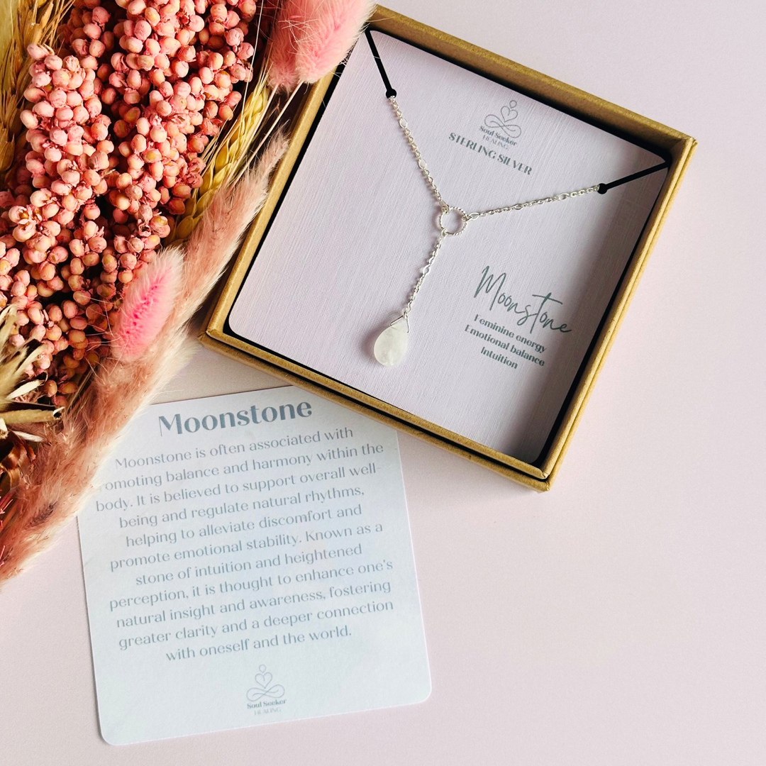 Moonstone necklace features a faceted moonstone teardrop bead on a delicate sterling silver figaro chain with a twisted sterling silver ring focal point. The necklace fastens with a subtle yet secure sterling silver bolt clasp. The teardrop bead measures 12mm x 8mm.