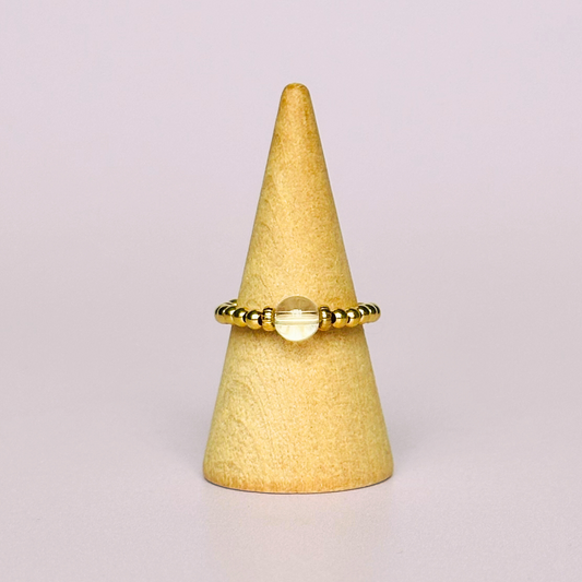 This gold vermeil clear quartz ring features a 6mm round ethically sourced clear quartz bead, surrounded by gold vermeil corrugated rondelle beads and delicate 2.5mm gold vermeil beads. April birthstone ring.