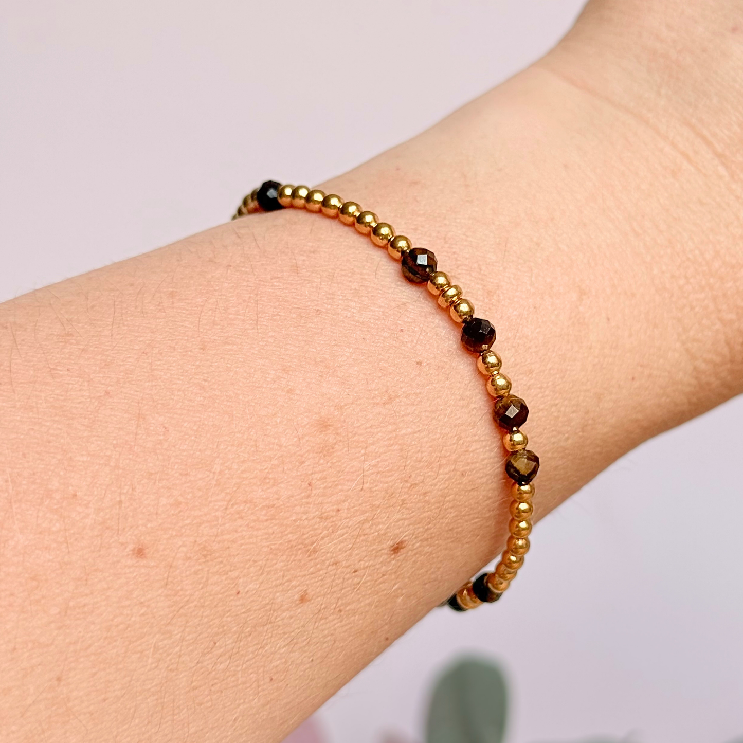 Tigers eye morse code bracelet that spells out the words ‘Ask, believe, receive’ in a combination of 4mm round smooth and faceted crystal beads with your choice of sterling silver or gold vermeil accent beads. Pictured in gold, being worn