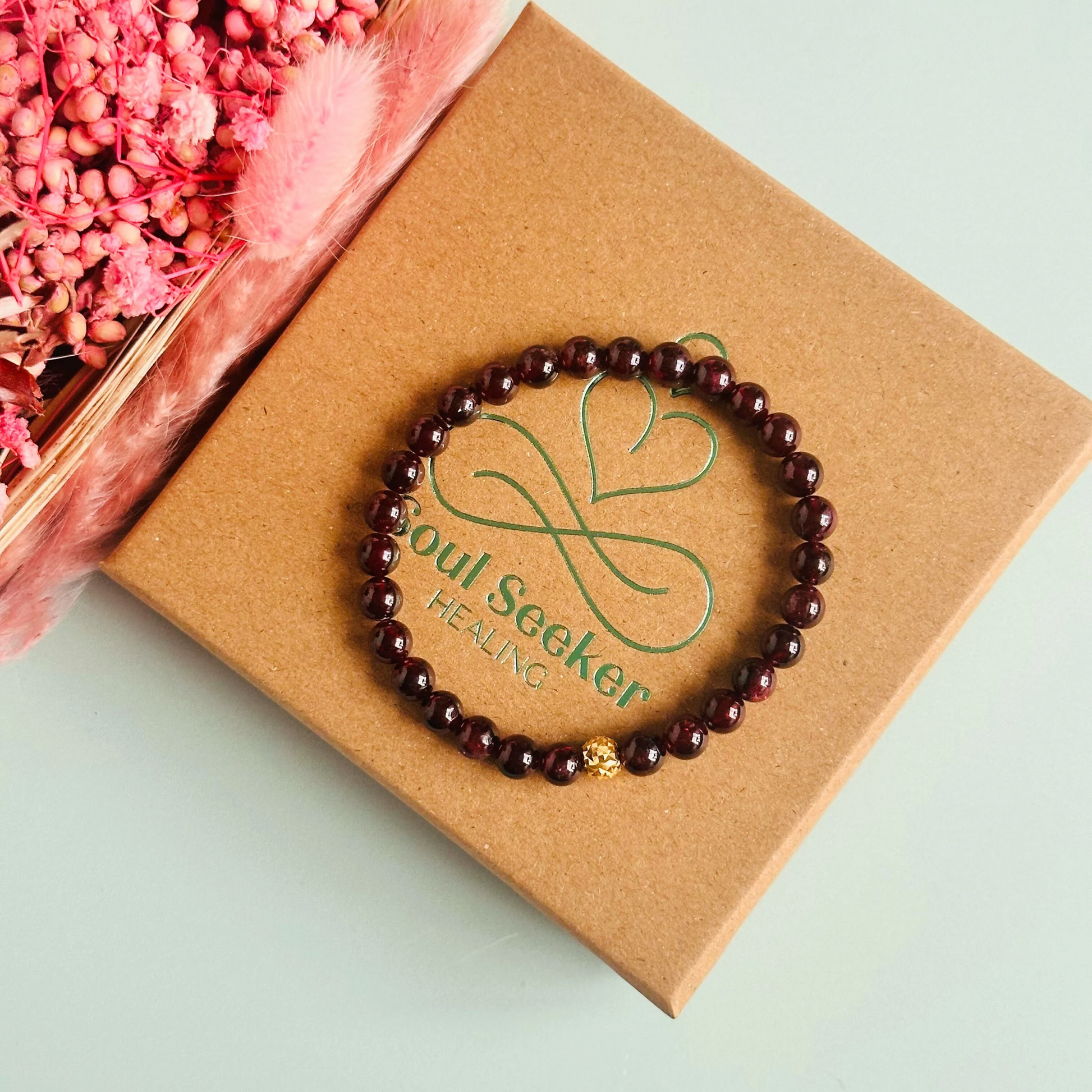 Garnet bracelet with a faceted sterling silver or gold vermeil focal bead. A bracelet for passion, success and confidence. Made with 6mm beads.