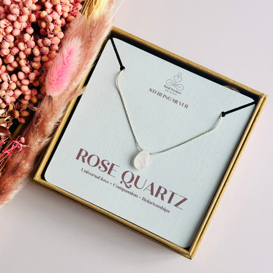 Dainty rose quartz teardrop necklace featuring a 12x8mm faceted rose quartz teardrop bead on a fine sterling silver beading chain.