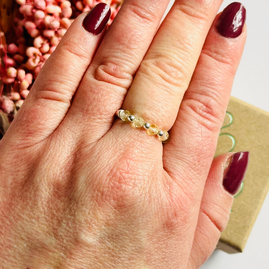 Citrine ring featuring five faceted 3mm citrine beads on a sterling silver elasticated band. November birthday ideas, November birthday gift, November birthstone ring, stretch ring, November jewellery, born in November, November woman