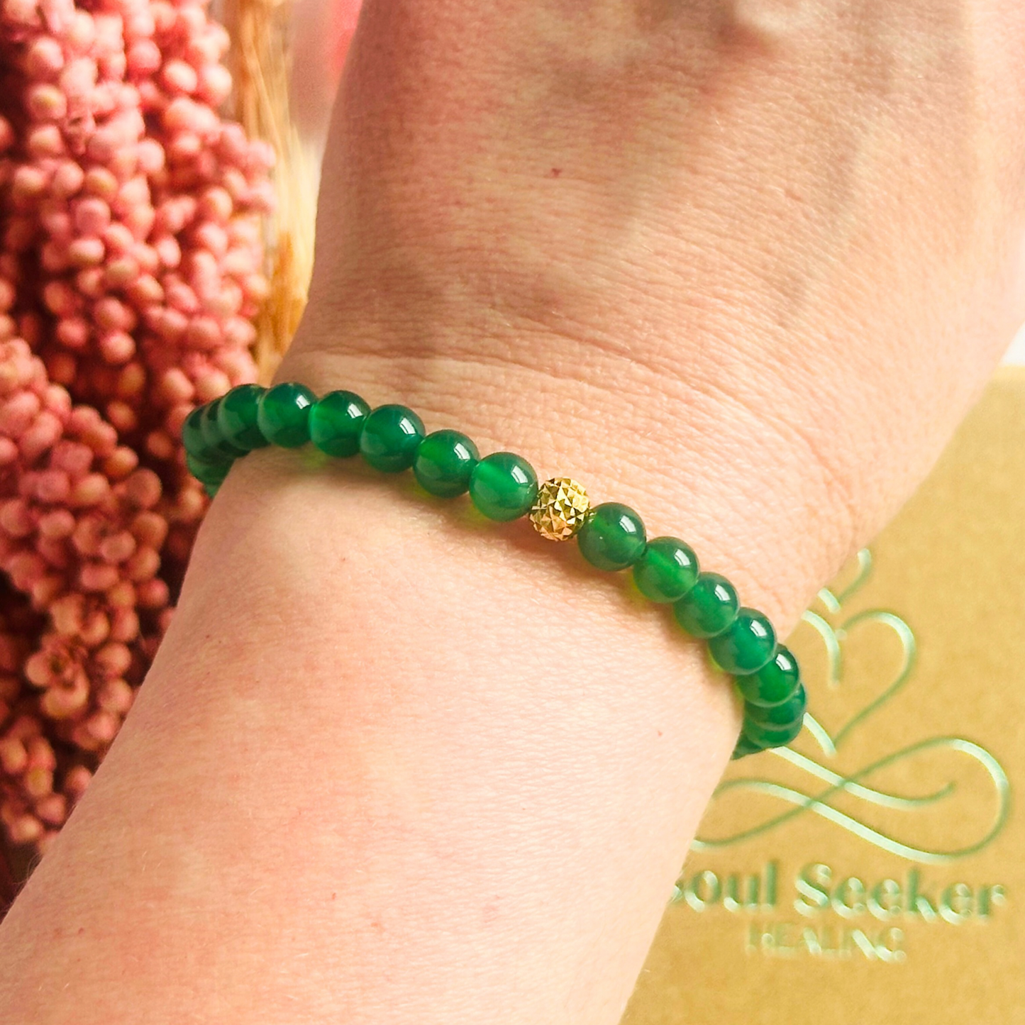 Green agate crystal healing bracelet made with 6mm smooth, round green agate beads and your choice of sterling silver or gold vermeil 6mm faceted focal bead. Elasticated for comfort.