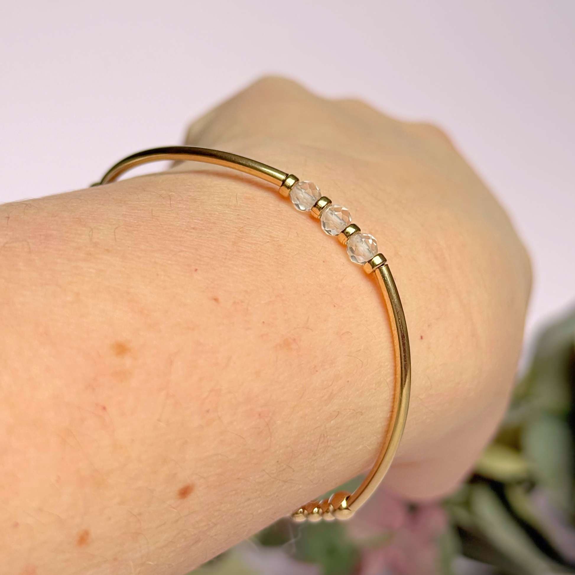 Gold filled elasticated stretch bracelet featuring five faceted clear quartz 4mm crystal beads, one to celebrate each decade for a 30th birthday present. April birthstone bracelet with gold filled tube beads and 3mm spacer beads.