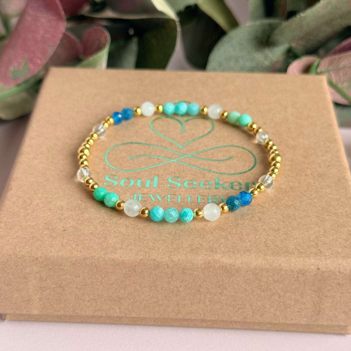‘Caribbean Dream' gold vermeil dainty beaded bracelet with white jade, chrysoprase, amazonite, apatite and clear quartz. Made with round 3mm gold vermeil beads and 4mm smooth and faceted round crystal gemstone beads. Pictured n top of the gift box 