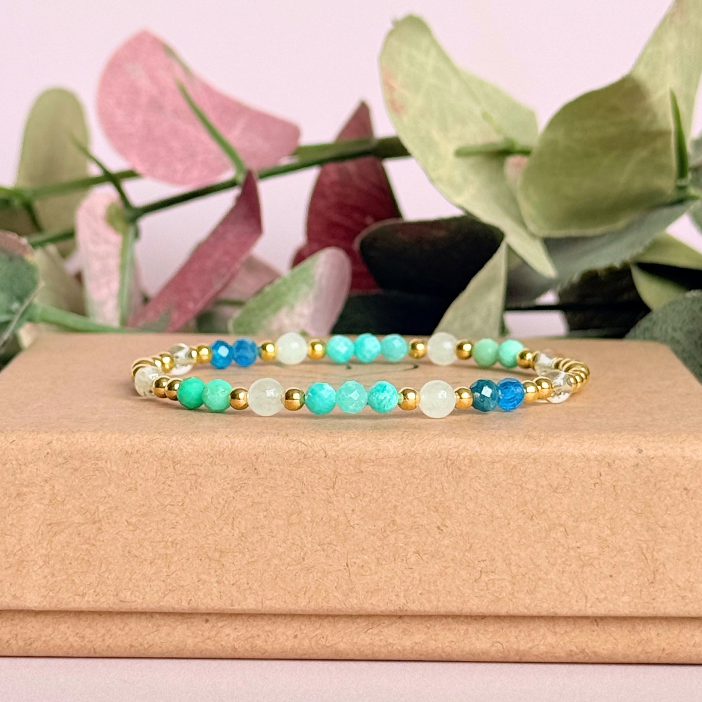 ‘Caribbean Dream' gold vermeil dainty beaded bracelet with white jade, chrysoprase, amazonite, apatite and clear quartz. Made with round 3mm gold vermeil beads and 4mm smooth and faceted round crystal gemstone beads. Pictured on the box