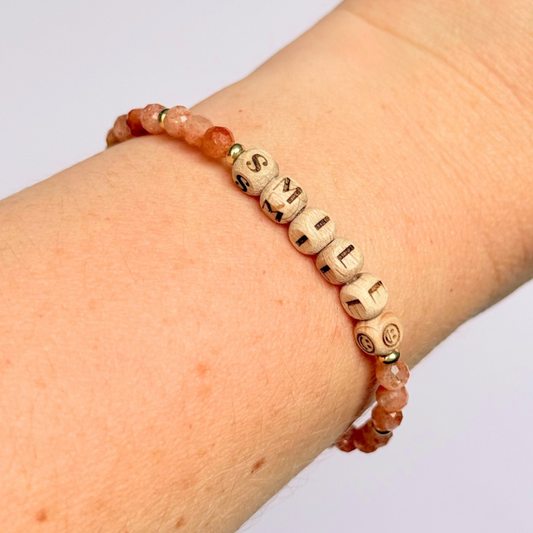 Bracelet featuring 5mm engraved wooden beads which you can personalise with your choice of words, numbers and symbols. The main the band of the bracelet is made with 4mm faceted sunstone round crystal gemstone beads. Finished with your choice of gold vermeil, sterling silver or rose gold vermeil accent beads.