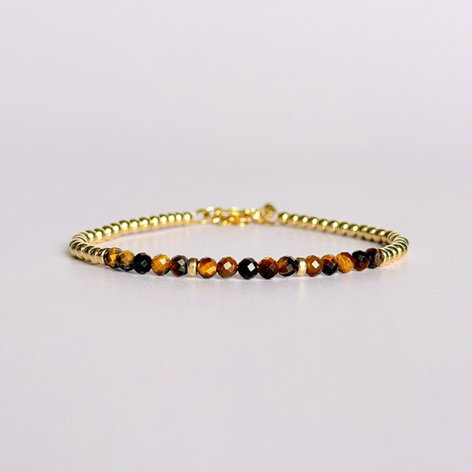 Dainty minimalist yellow gold filled crystal bracelet featuring 3mm faceted tigers eye beads with 3mm gold filled beads. Fastens with a gold filled lobster clasp with an extender chain.